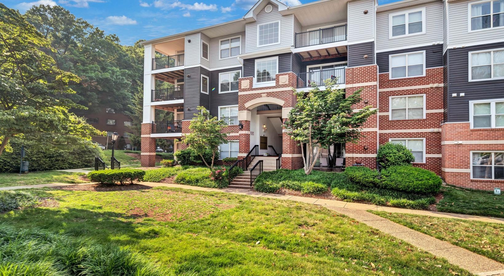 Find your perfect fit at Columbia Crossing a large brick building with a lawn in front of it